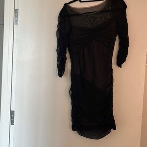 Black dress with sheer detail. Stretchy flattering fabric